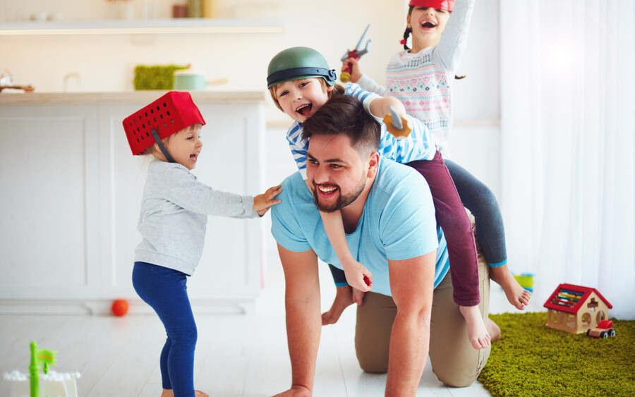 Dad playing with children