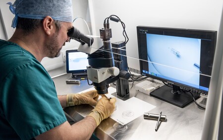 Scientist using a microscope