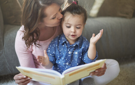 A mother reading to her daughter