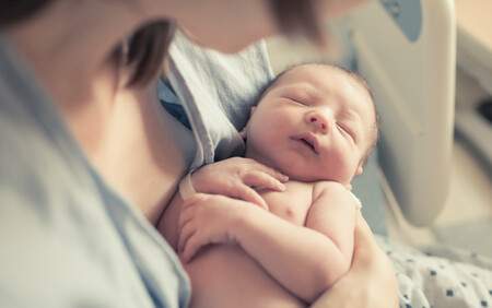 woman holding newborn baby