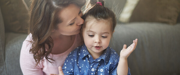 A mother reading to her daughter