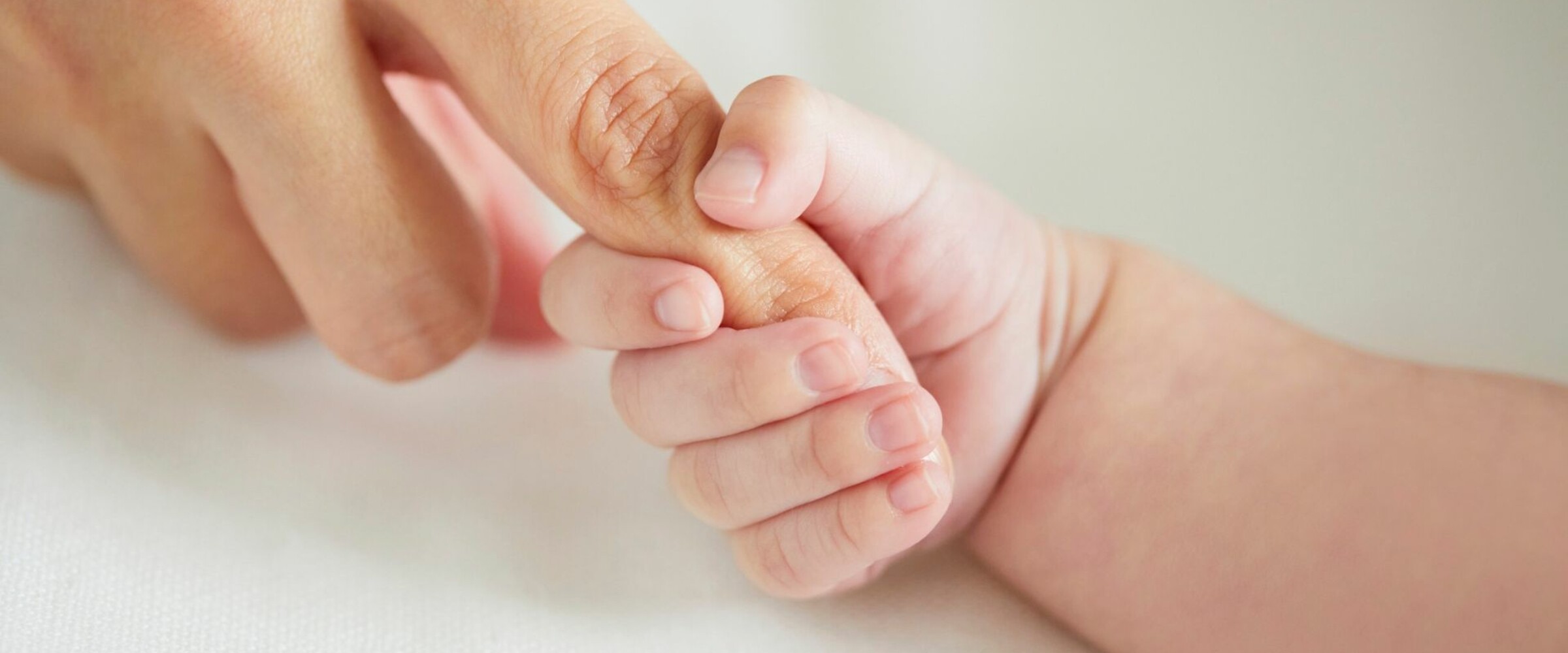 Mother and child holding hands