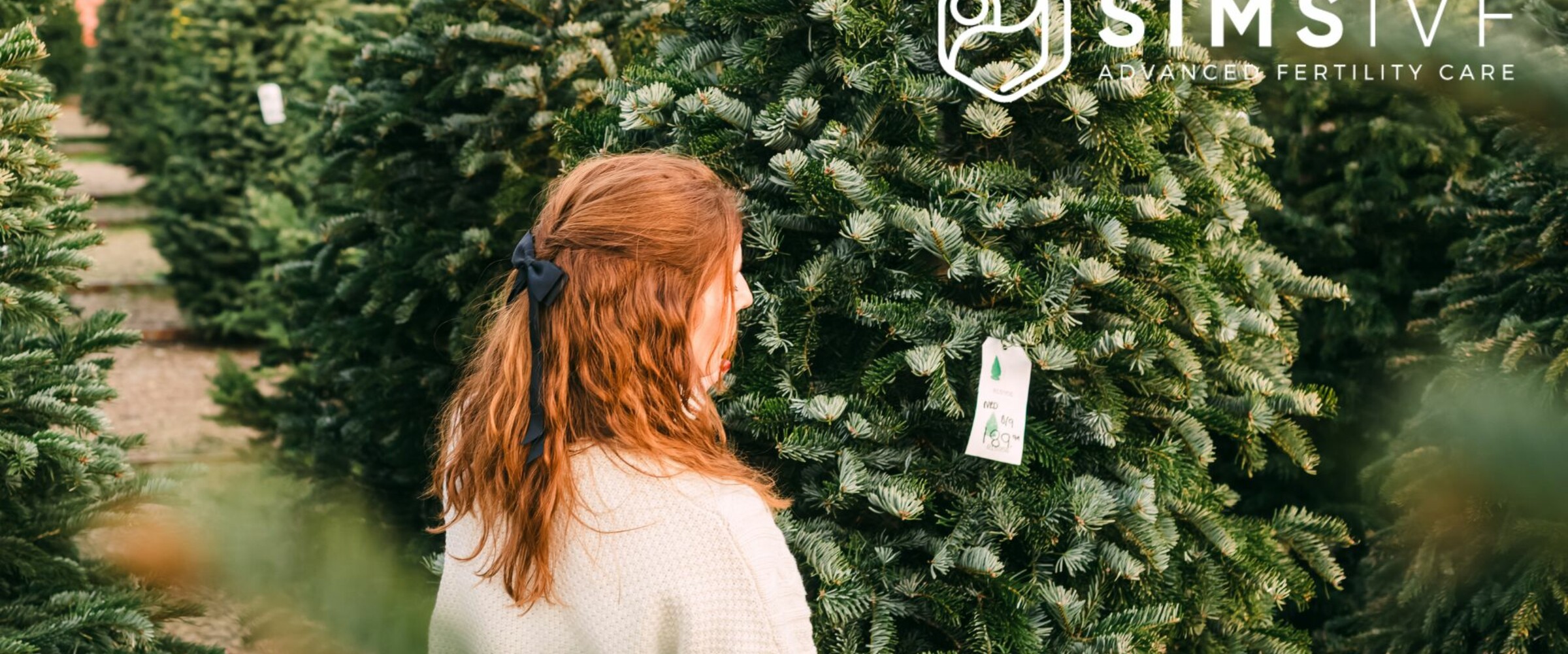Woman at Christmas Tree